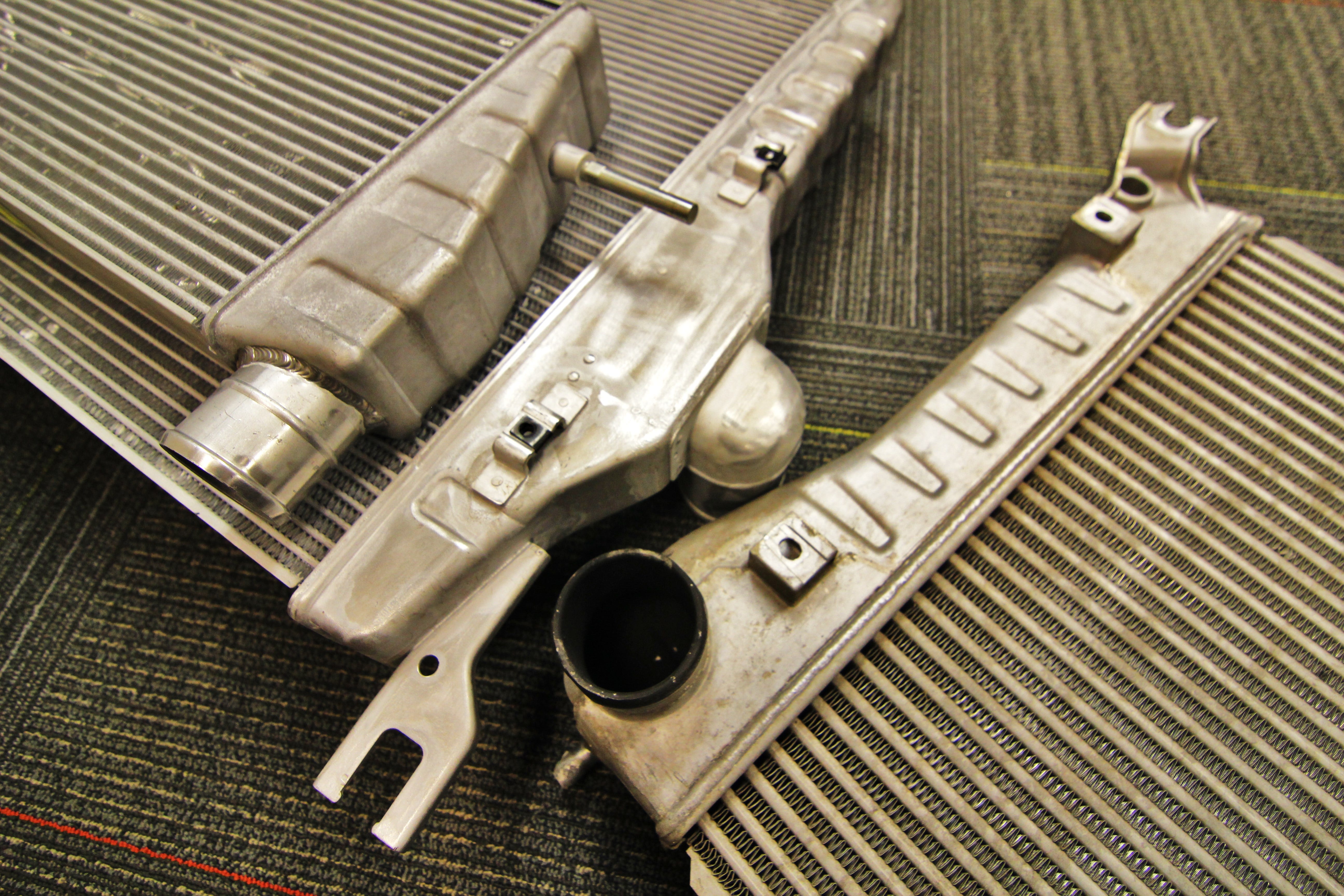 Stamped intercooler end tanks