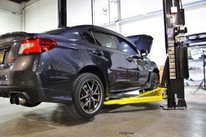Test vehicle on lift for 2015 STI parts development