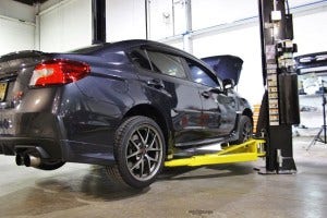 Test vehicle on lift for 2015 STI parts development 