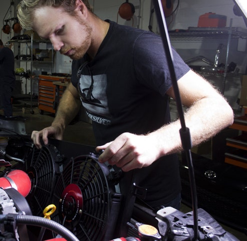 Jason, dropping the black Mishimoto BRZ fan shroud into his FR-S