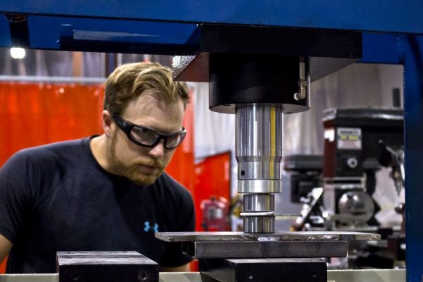 Jason adding some style to our prototype bracket with a dimple die on the press.