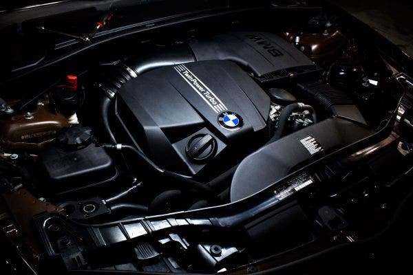 Our N55 catch can prototype stealthily lurking in the corner of the 135i's engine bay.