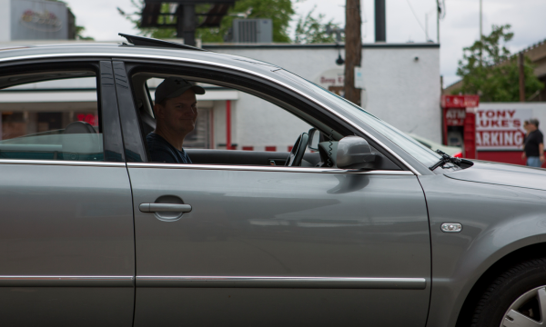 The Euro Cheesesteak Run's organizer Chris Walsh waits to enter the lot on Oregon Ave. in Philadelphia outside of Tony Luke's Cheesesteak Stand.