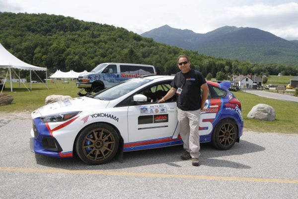 Tim O'Neil with his team's rally prepped Focus RS. Photo courtesy of Karl Stone and Team O'Neil. 
