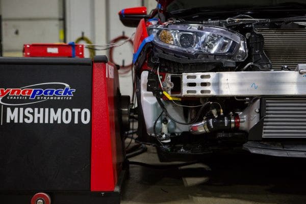 You may notice the excess of wires stemming from our loaner Civic. While it may seem like we are recreating Frankenstein's monster, we are actually capturing and recording as much data as possible to deliver the most accurate dyno results.