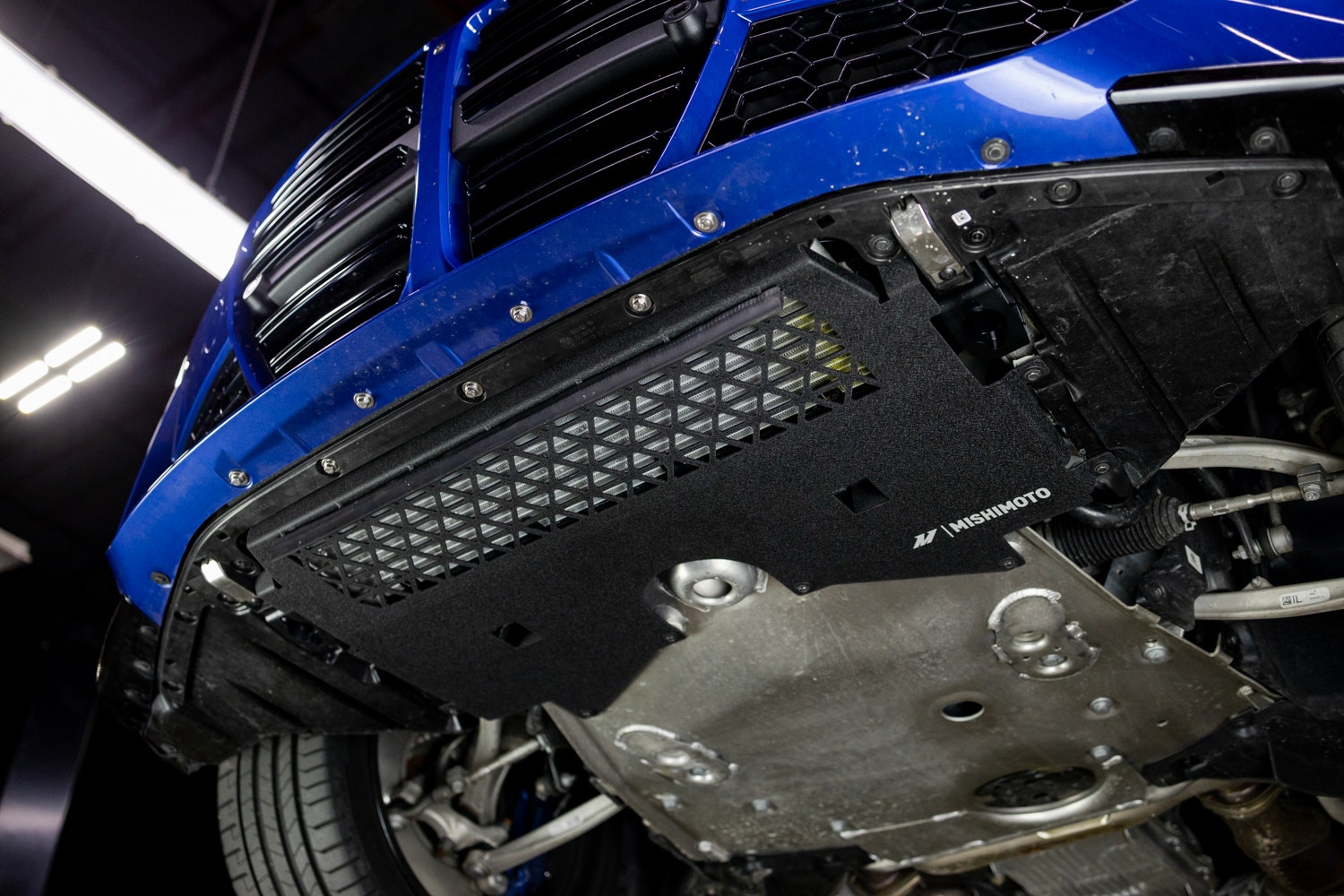 Mishimoto skid plate on a blue BMW G8X.