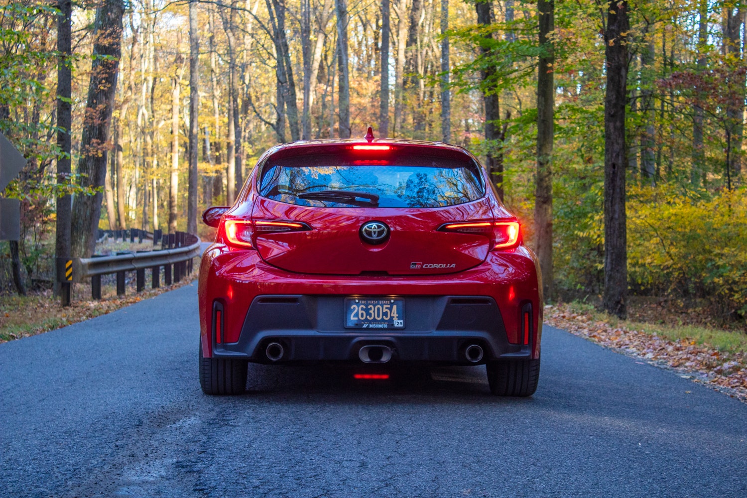 The back of a 2023 Toyota GR Corolla, showcasing the three tailpipes.