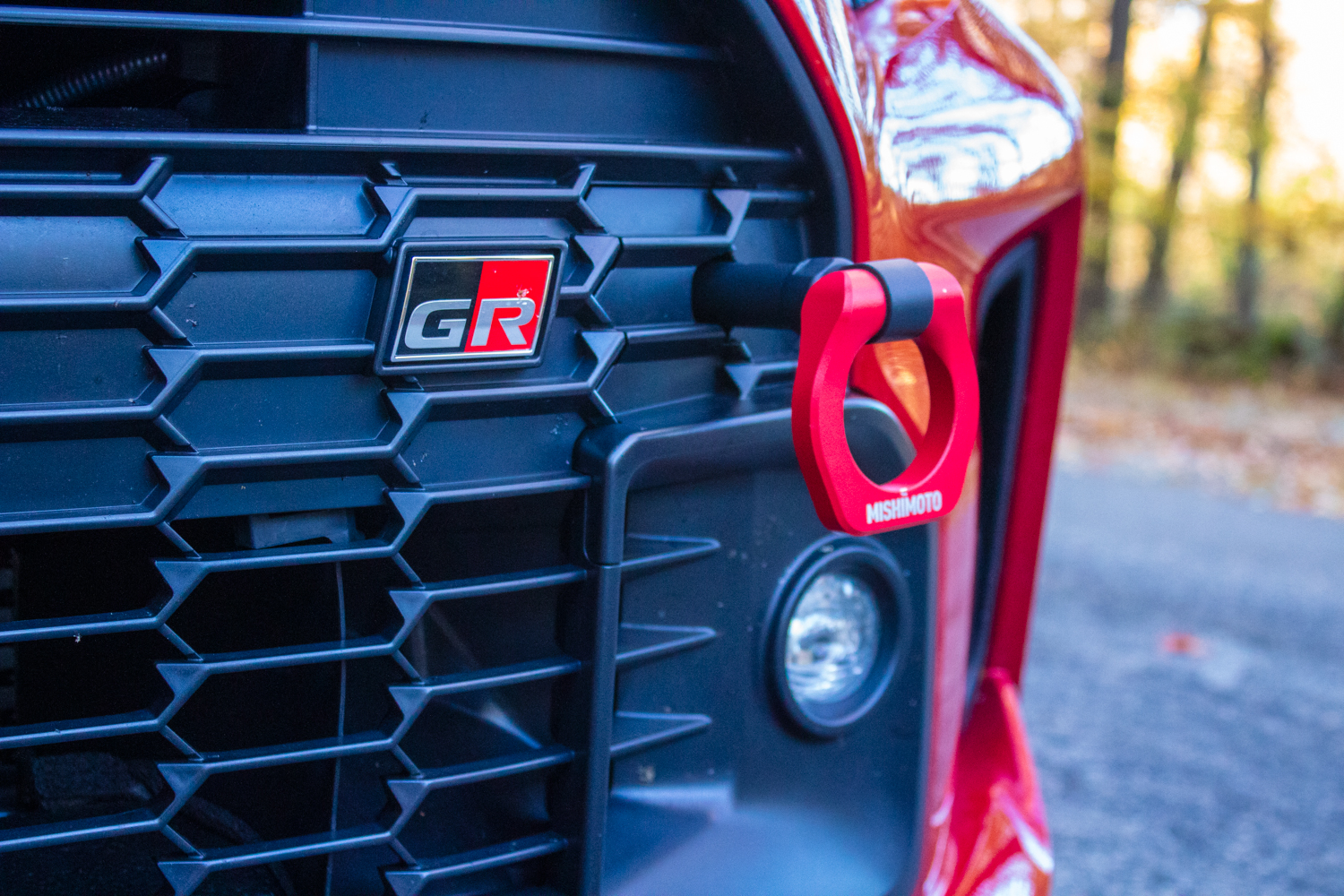 The Mishimoto Racing Tow Hook installed on the 2023 Toyota GR Corolla.