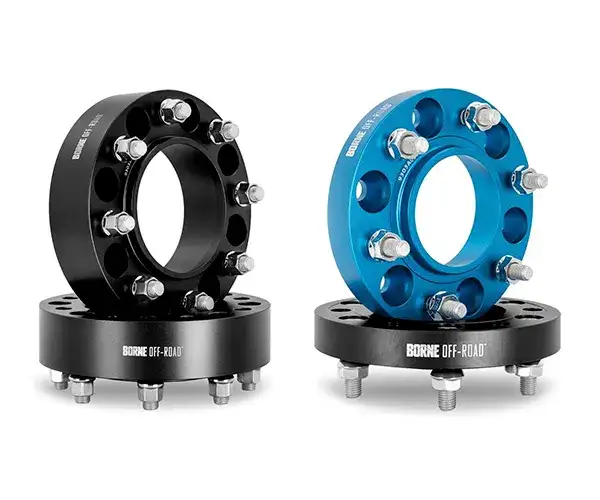 An image of a black and a blue wheel spacer.