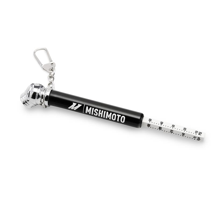 An image of a miniature tire pressure gauge with a keychain attachment.