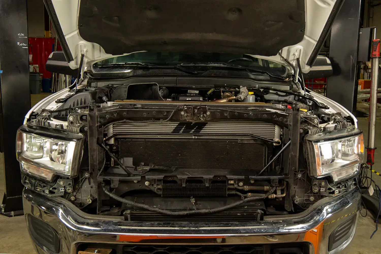 Image of the Mishimoto Performance Transmission Cooler for the 2019+ RAM 6.7L Cummins installed.