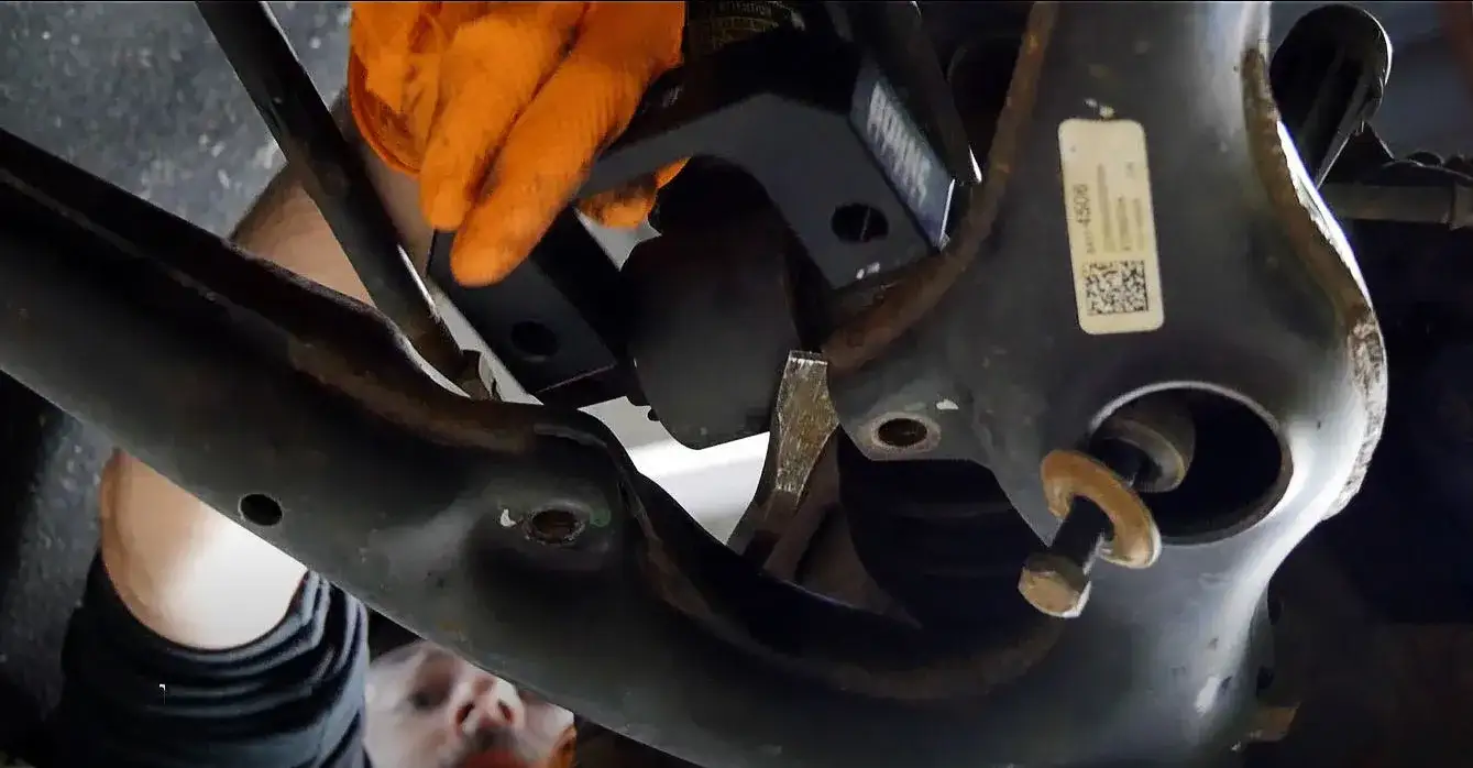 a mechanic installing a lift kit or leveling kit